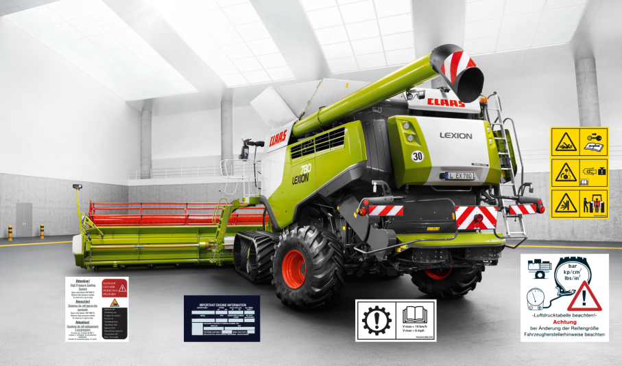 Landmaschine mit Typenschildern und Warntafeln