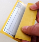 Folding open the laminate of a plusprotect label